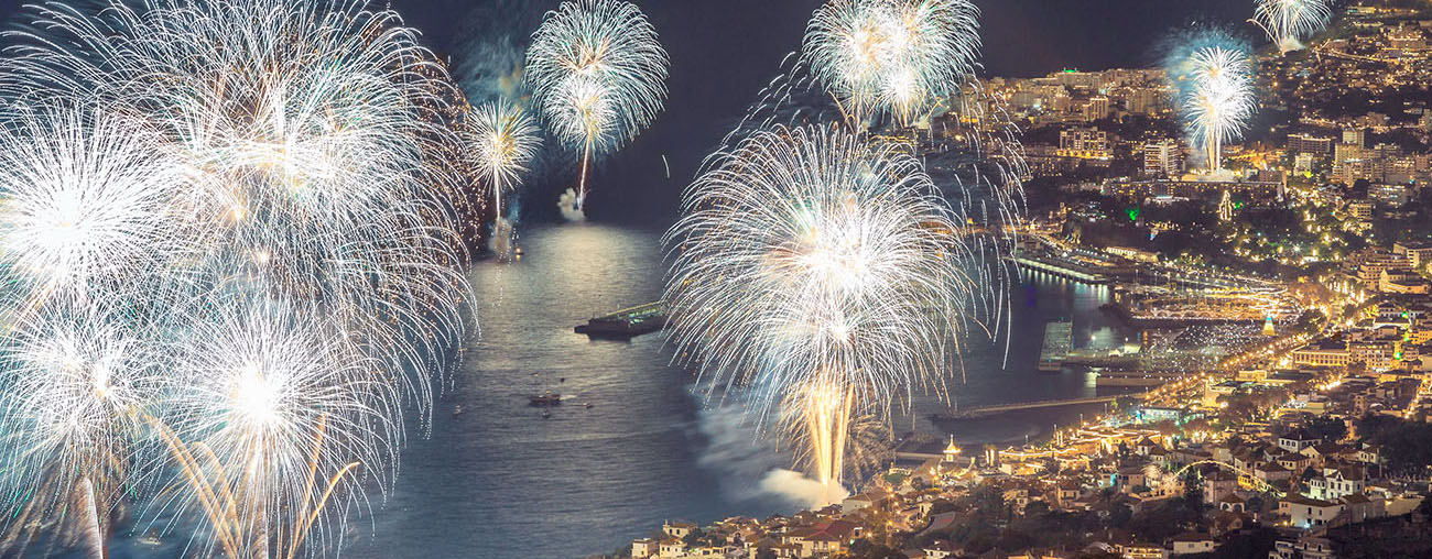 Spectacular New Year's Eve Fireworks in Funchal, Madeira New Year's Eve fireworks lighting up the night sky over Funchal, Madeira