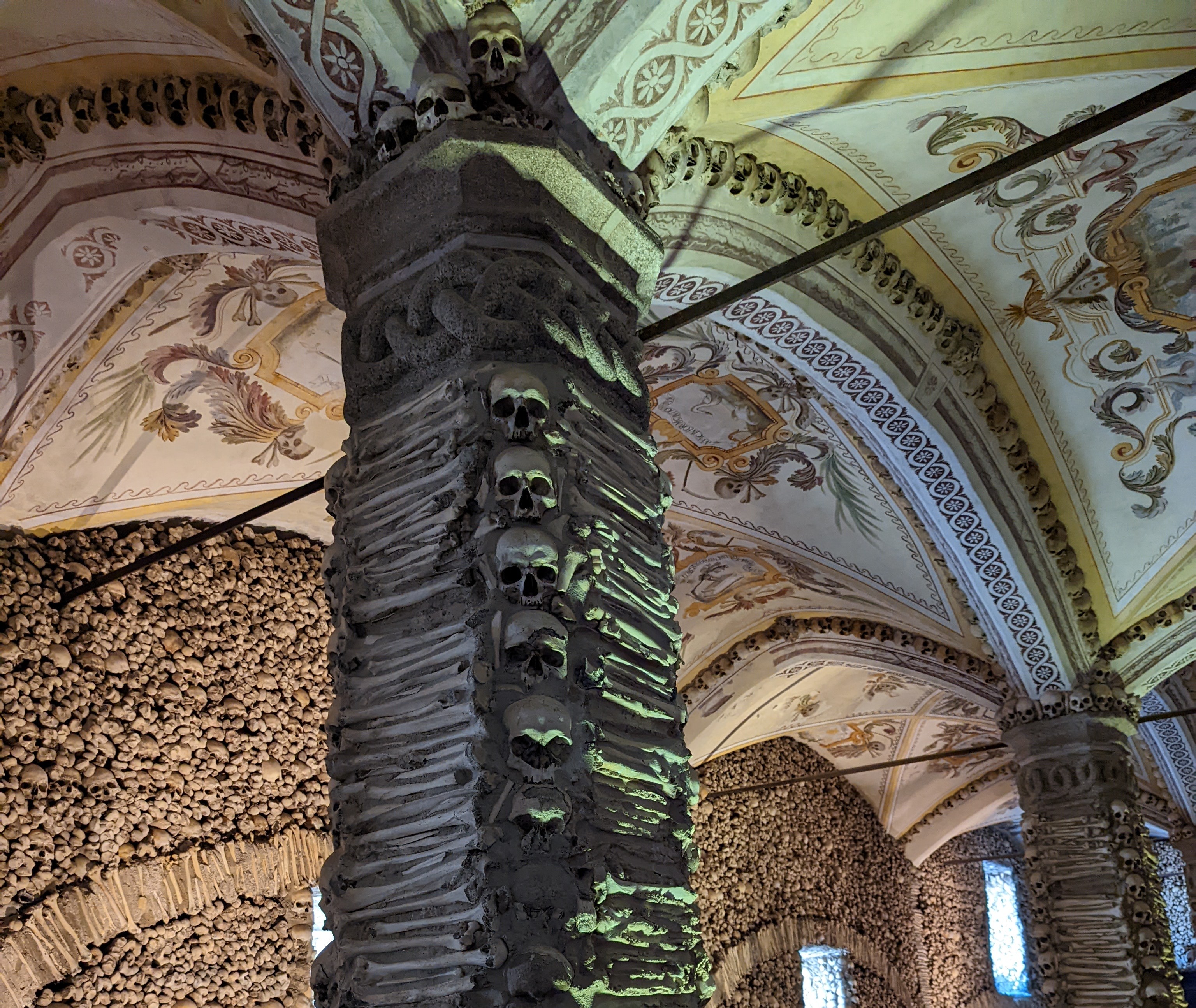Wall of skulls inside the Chapel of Bones Evora Portugal Chapel of Bones
