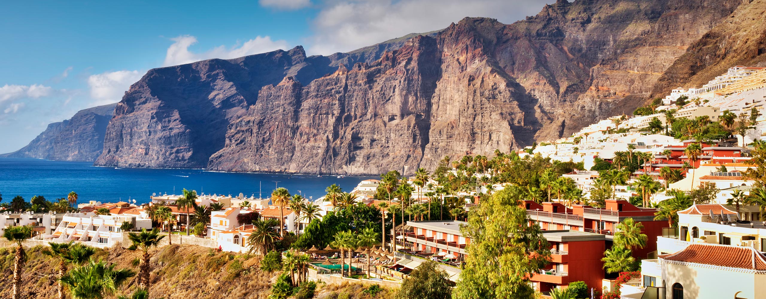 Dramatic cliffs of Los Gigantes rising from the blue Atlantic Ocean in Tenerife