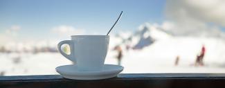 Morning coffee against a snowy backdrop
