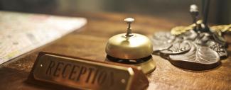 A bell on a Hotel reception desk